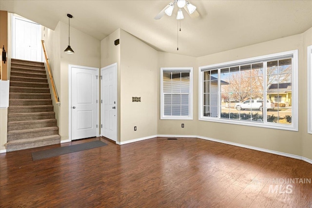 interior space with dark wood-type flooring, ceiling fan, and lofted ceiling