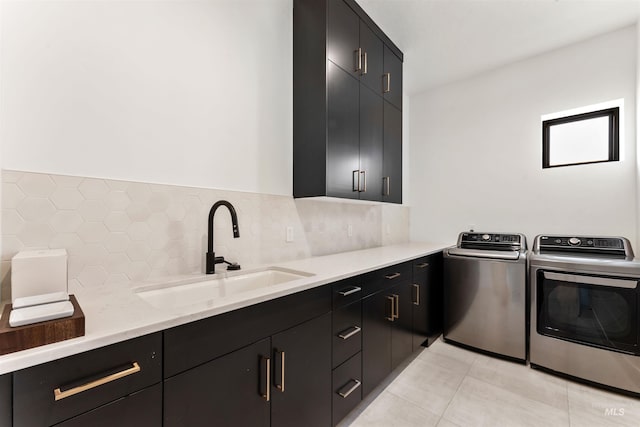 3149 N Lancaster Pl, Boise, ID 83702 - laundry area with washing machine and dryer, cabinet space, and light tile patterned floors