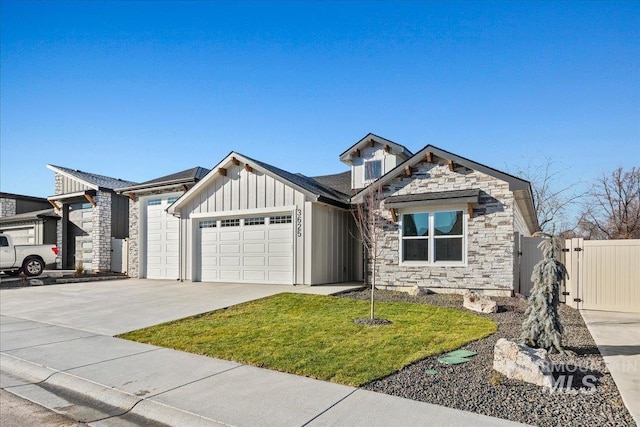 view of front facade featuring driveway, stone siding, an attached garage, a front lawn, and board and batten siding