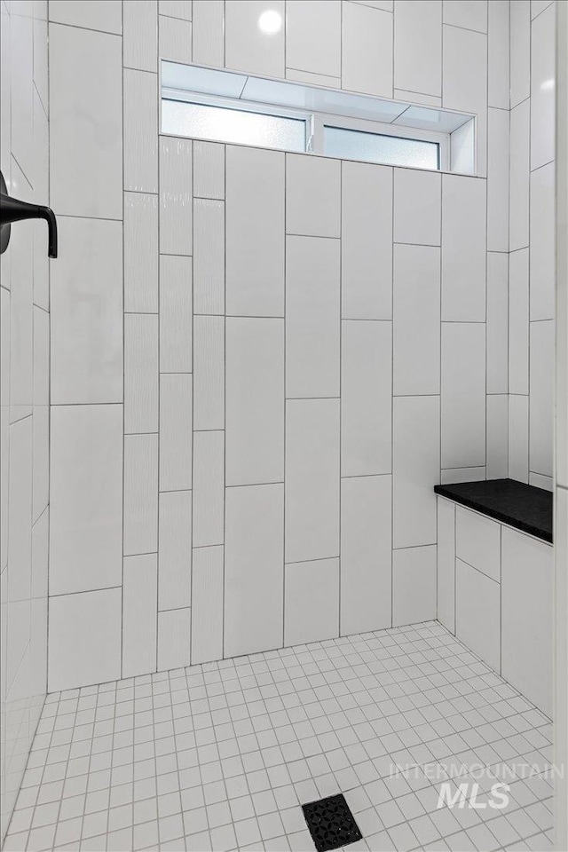 interior space with tiled shower