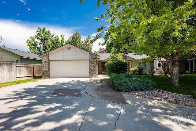 5426 W Samara Ct, Boise, ID 83703 - view of front facade with concrete driveway, an attached garage, and brick siding