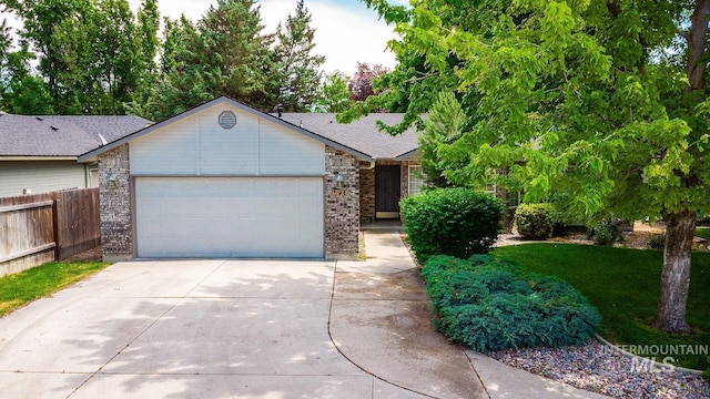 5426 W Samara Ct, Boise, ID 83703 - ranch-style home with driveway, an attached garage, and brick siding