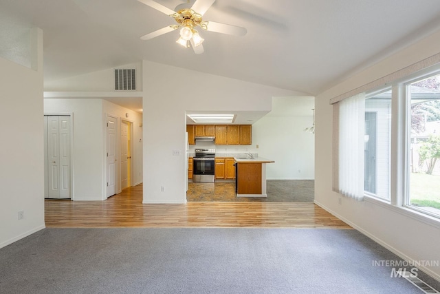5426 W Samara Ct, Boise, ID 83703 - unfurnished living room with light carpet, plenty of natural light, a ceiling fan, high vaulted ceiling, and light wood-style floors