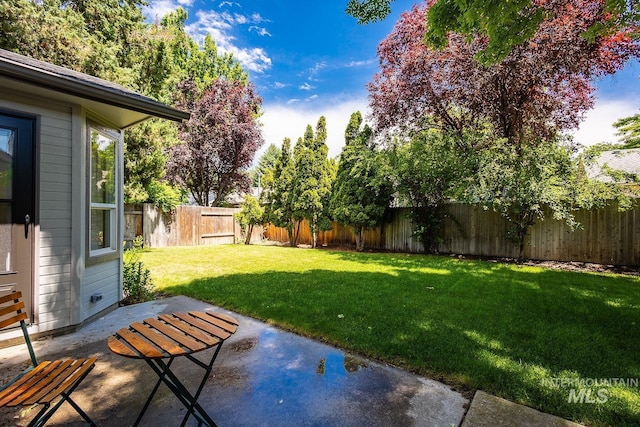 5426 W Samara Ct, Boise, ID 83703 - fenced backyard featuring a patio area