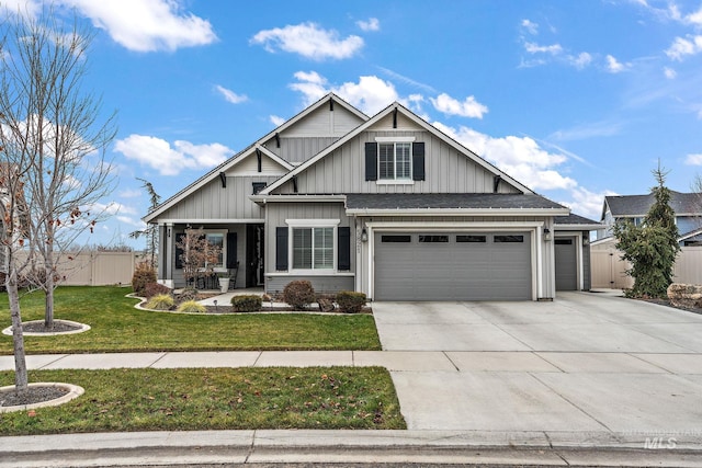 craftsman inspired home featuring a front lawn and a garage