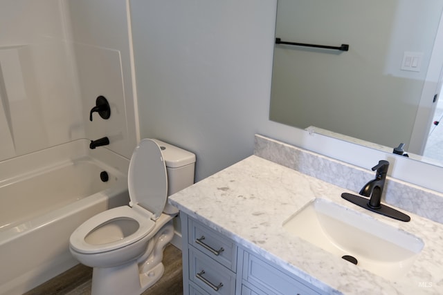 602 E Freeport St, Caldwell, ID 83605 - full bath with toilet, vanity, tub / shower combination, and wood finished floors
