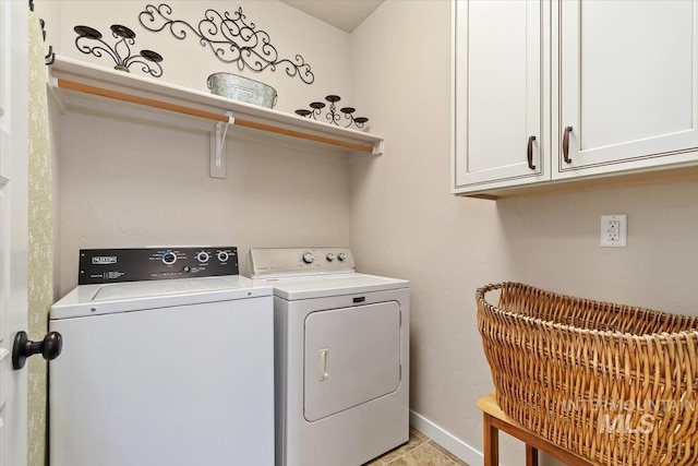 27482 Warren Ln, Wilder, ID 83676 - laundry area featuring washing machine and clothes dryer and cabinet space
