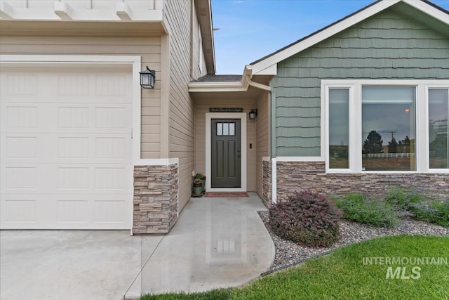 27482 Warren Ln, Wilder, ID 83676 - entrance to property with stone siding and a garage