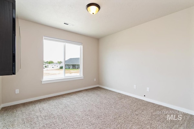 27482 Warren Ln, Wilder, ID 83676 - carpeted spare room featuring baseboards