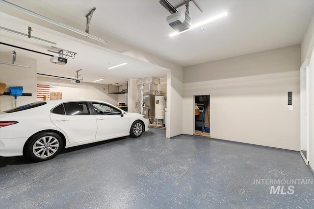 27482 Warren Ln, Wilder, ID 83676 - garage with a garage door opener and water heater
