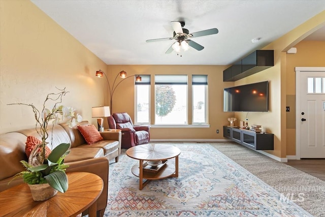 27482 Warren Ln, Wilder, ID 83676 - living area with arched walkways and a ceiling fan