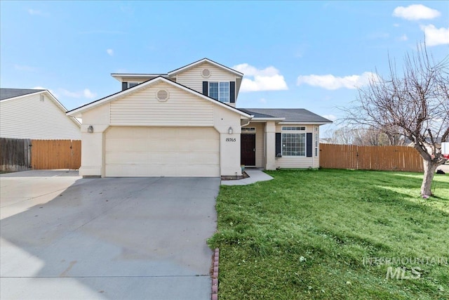 traditional-style home featuring a front lawn, concrete driveway, a garage, and fence