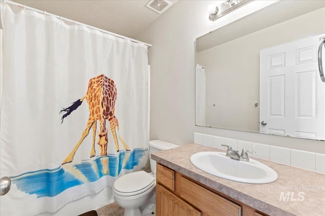 bathroom featuring visible vents, toilet, a textured ceiling, a shower with shower curtain, and vanity