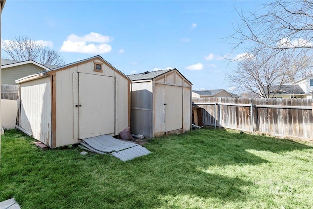 view of shed with a fenced backyard