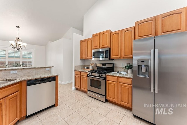1730 W Glade Creek St, Meridian, ID 83646 - kitchen with appliances with stainless steel finishes, a chandelier, light tile patterned floors, pendant lighting, and high vaulted ceiling