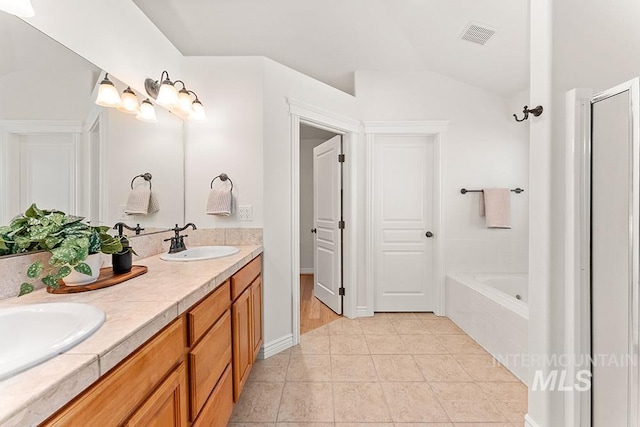 1730 W Glade Creek St, Meridian, ID 83646 - bathroom with a bathtub, double vanity, vaulted ceiling, tile patterned flooring, and a shower