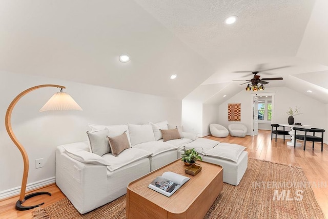 1730 W Glade Creek St, Meridian, ID 83646 - living area featuring light wood-style flooring, a ceiling fan, lofted ceiling, and recessed lighting