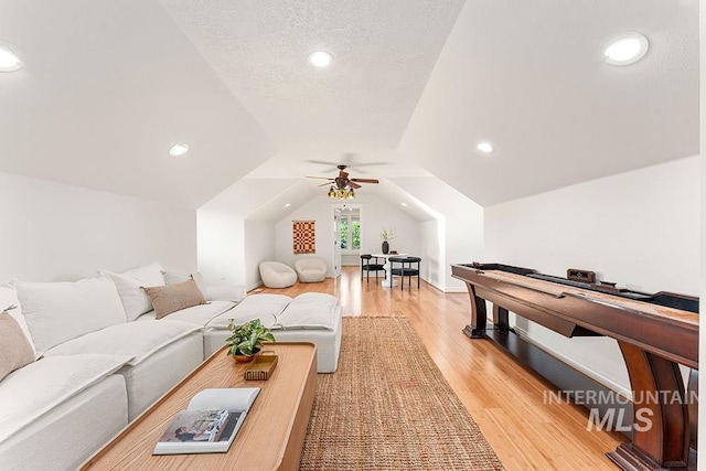 1730 W Glade Creek St, Meridian, ID 83646 - living area with light wood-style flooring, vaulted ceiling, ceiling fan, and recessed lighting