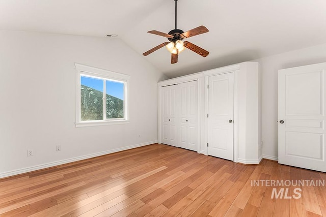 1730 W Glade Creek St, Meridian, ID 83646 - unfurnished bedroom featuring vaulted ceiling, light wood finished floors, multiple closets, and ceiling fan