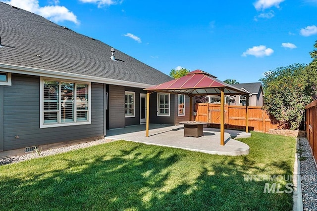1730 W Glade Creek St, Meridian, ID 83646 - back of house with a gazebo, a fenced backyard, a patio area, a fire pit, and roof with shingles