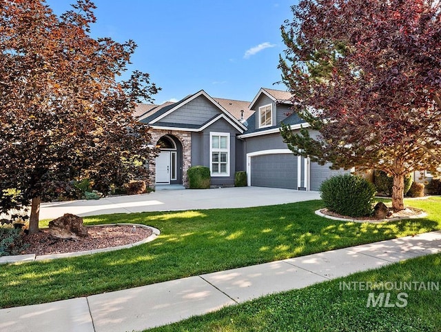 1730 W Glade Creek St, Meridian, ID 83646 - view of front of home with a front yard, concrete driveway, and an attached garage