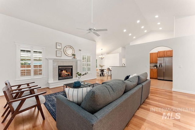 1730 W Glade Creek St, Meridian, ID 83646 - living room with recessed lighting, a tile fireplace, ceiling fan, plenty of natural light, and light wood-style floors