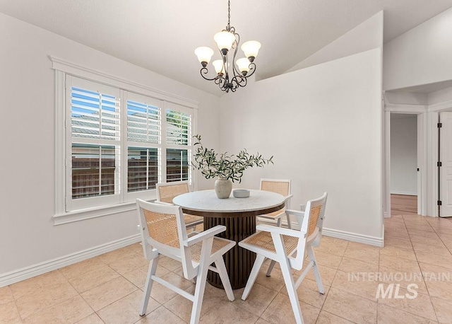 1730 W Glade Creek St, Meridian, ID 83646 - dining area with a chandelier, light tile patterned floors, and lofted ceiling