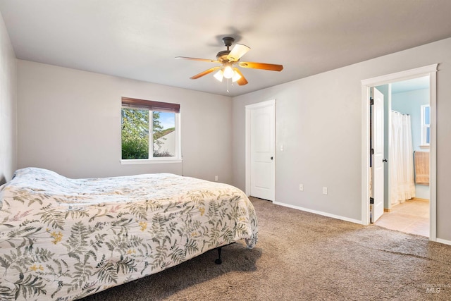 bedroom featuring light carpet, baseboards, and ceiling fan