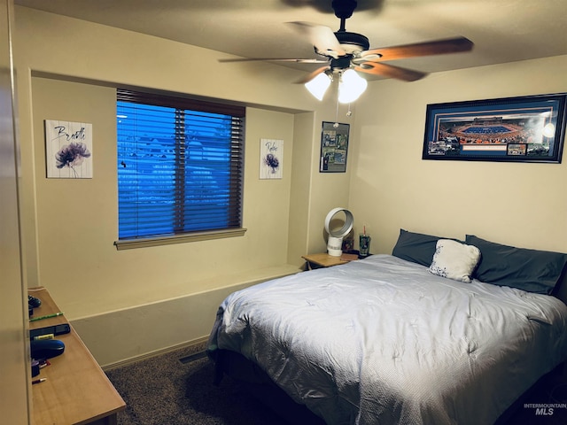 carpeted bedroom featuring a ceiling fan