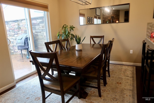 dining area featuring light wood-type flooring