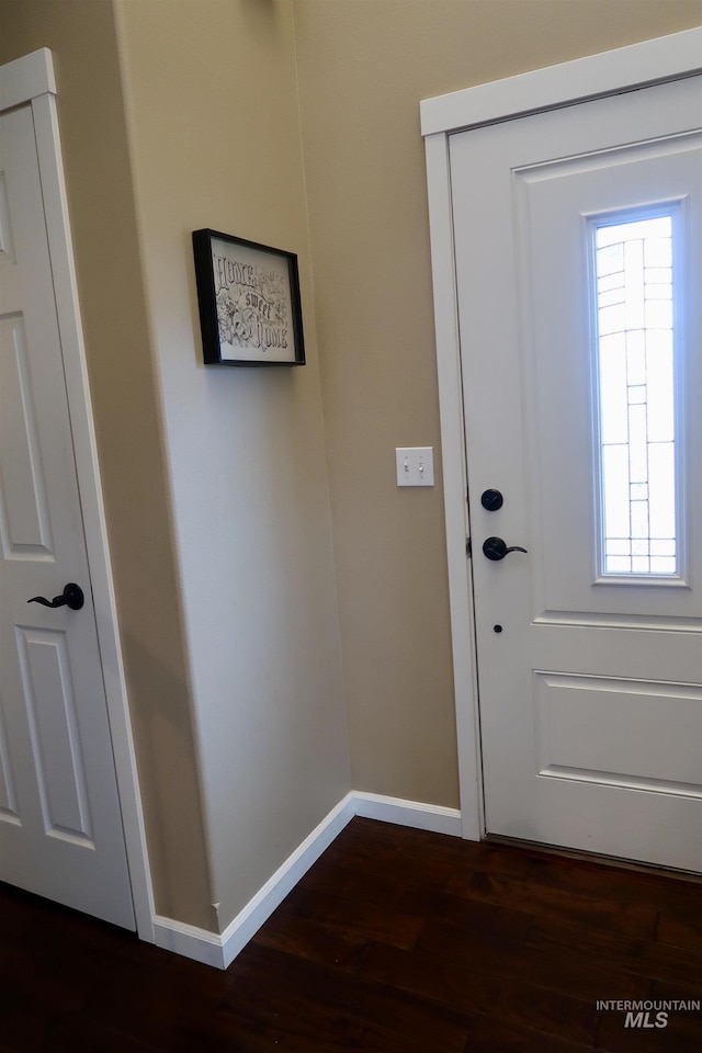 doorway with dark hardwood / wood-style flooring