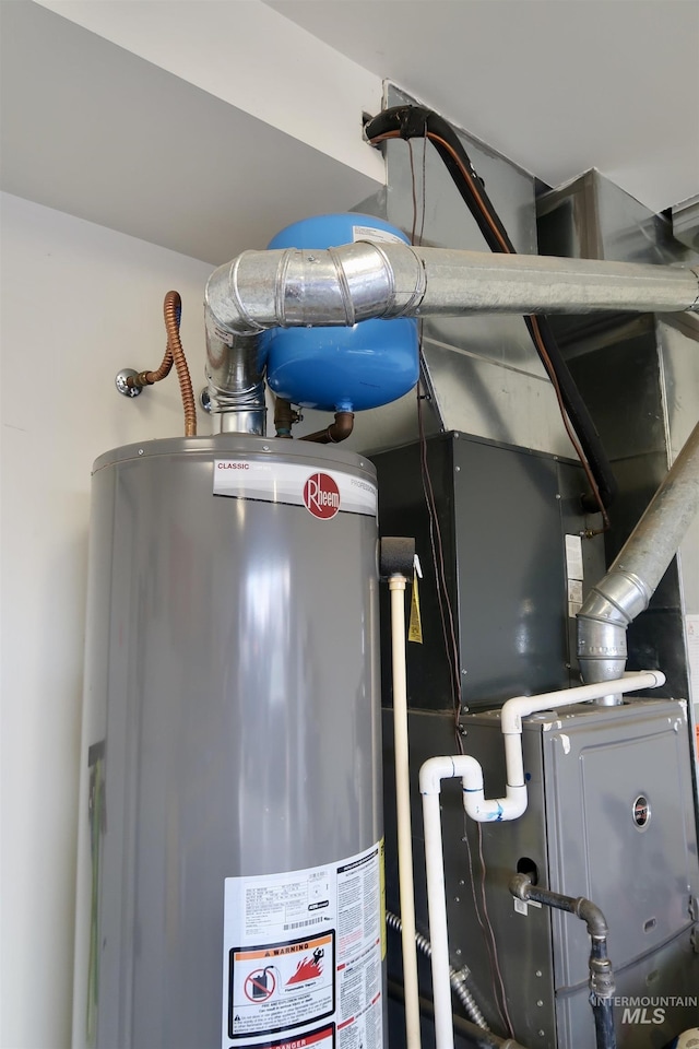 utility room featuring gas water heater