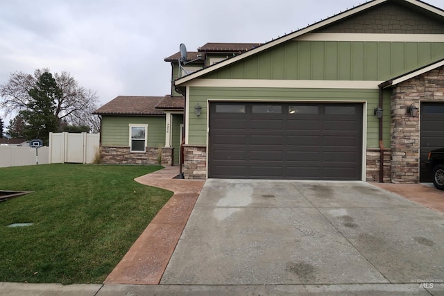 craftsman-style house featuring a garage and a front yard