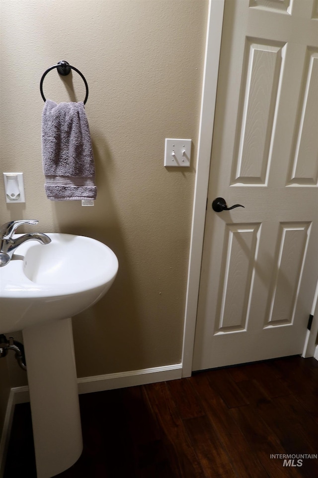 bathroom featuring hardwood / wood-style floors and sink