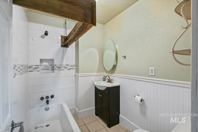519 S 5th Ave, Nampa, ID 83651 - bathroom with vanity, tile patterned flooring, shower / tub combination, and wainscoting