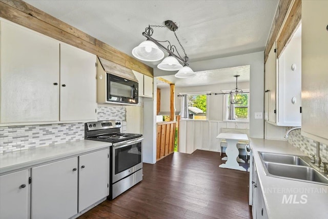 519 S 5th Ave, Nampa, ID 83651 - kitchen featuring stainless steel appliances, light countertops, tasteful backsplash, and white cabinets