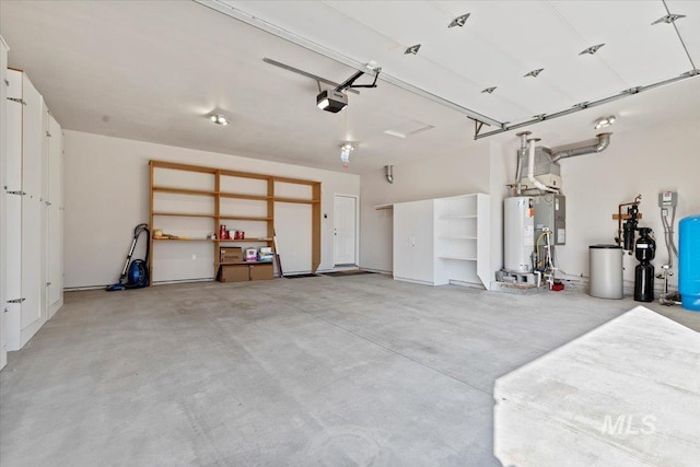 garage featuring gas water heater and a garage door opener