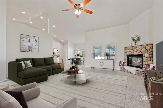 living room featuring ceiling fan, carpet, a fireplace, high vaulted ceiling, and recessed lighting