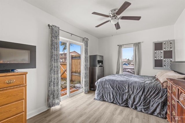 bedroom featuring access to outside, ceiling fan, and light hardwood / wood-style floors