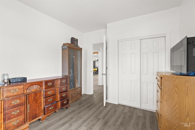 bedroom featuring hardwood / wood-style flooring and a closet