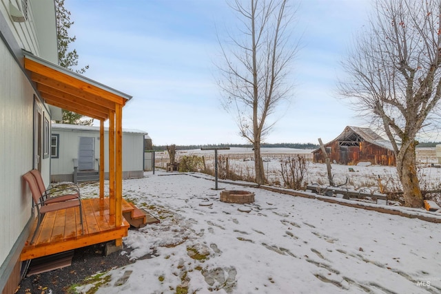 snowy yard with a fire pit