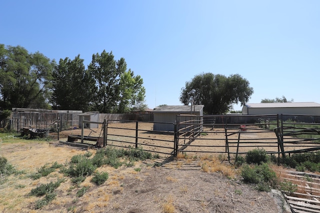 view of yard with an exterior structure and an outbuilding