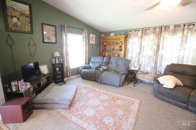 living room with lofted ceiling, carpet floors, and ceiling fan
