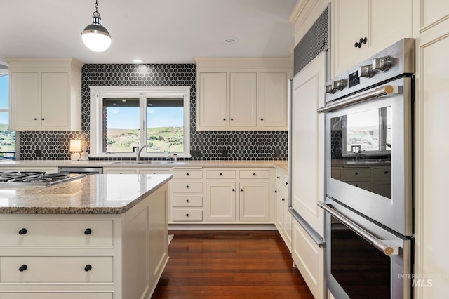 176 Marine View Dr, Lewiston, ID 83501 - kitchen with appliances with stainless steel finishes, a sink, backsplash, and dark wood-type flooring