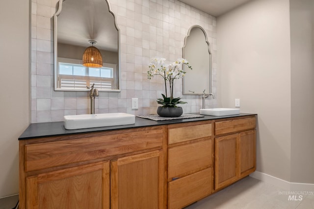 176 Marine View Dr, Lewiston, ID 83501 - bathroom with tasteful backsplash, double vanity, and baseboards