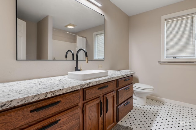 176 Marine View Dr, Lewiston, ID 83501 - bathroom with toilet, vanity, baseboards, a shower with shower curtain, and tile patterned floors