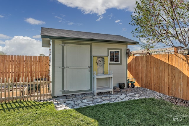 view of shed featuring a fenced backyard