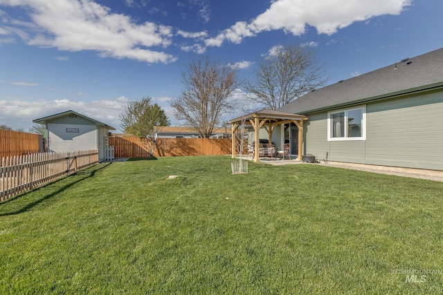 view of yard featuring a fenced backyard, a gazebo, and a patio area