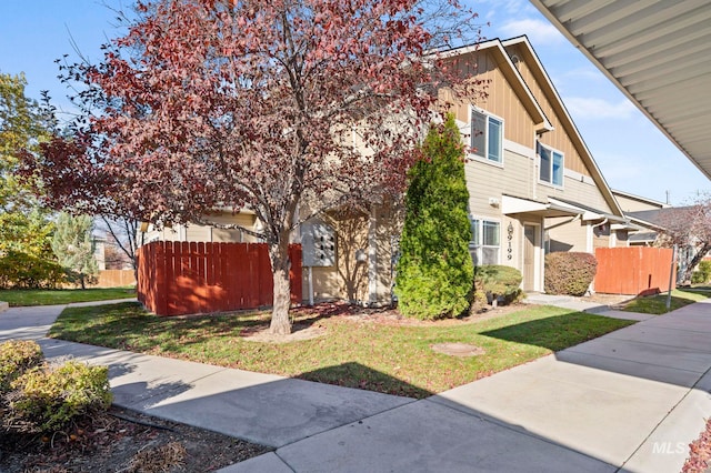 view of property exterior featuring a lawn