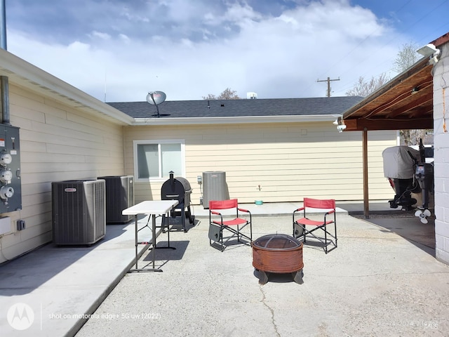 1018 S Washington Ave, Emmett, ID 83617 - view of patio / terrace with central AC unit and an outdoor fire pit